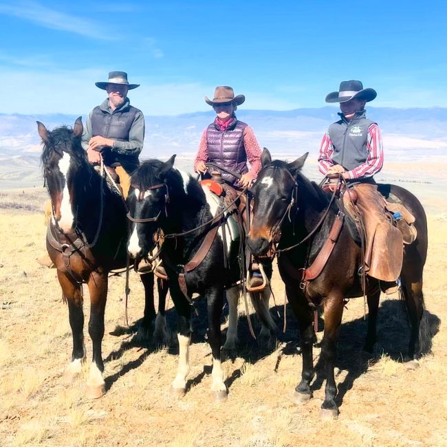 A group of horseback riders on a private horseback trail ride at Rusty Spurr Ranch, high in the Colorado backcountry.